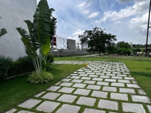 Open villa plots in Shamirpet offering greenery and well-maintained layout