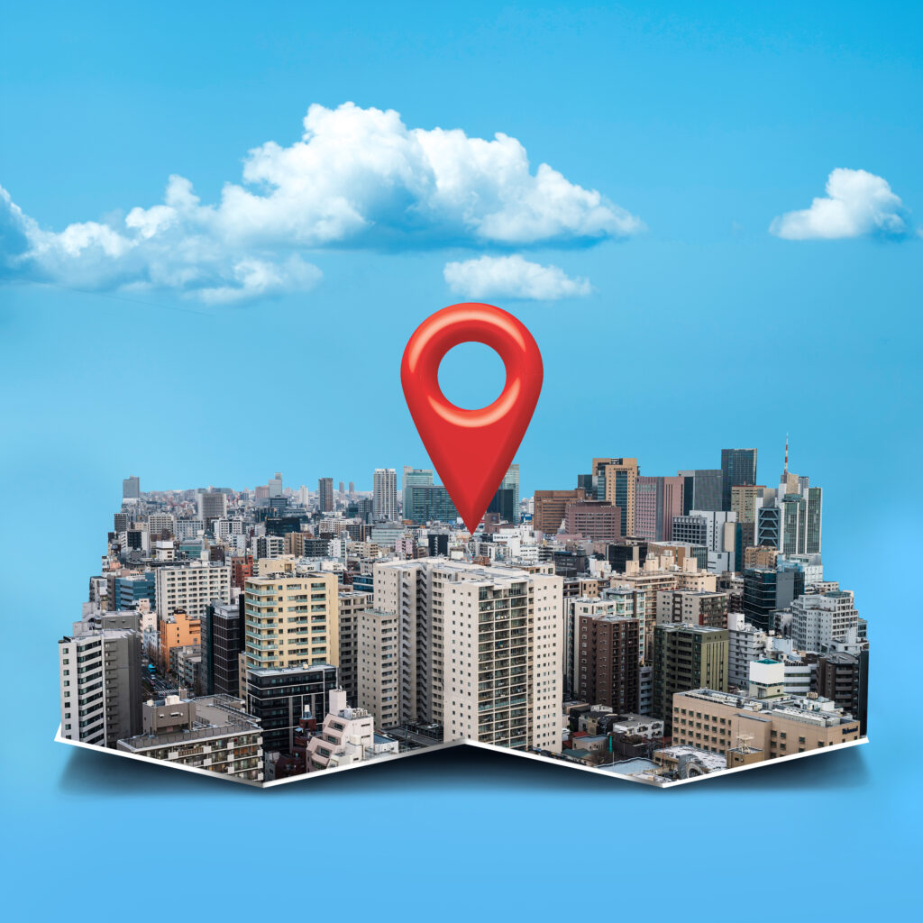 Modern city skyline with a location pin representing the best real estate developers in Hyderabad